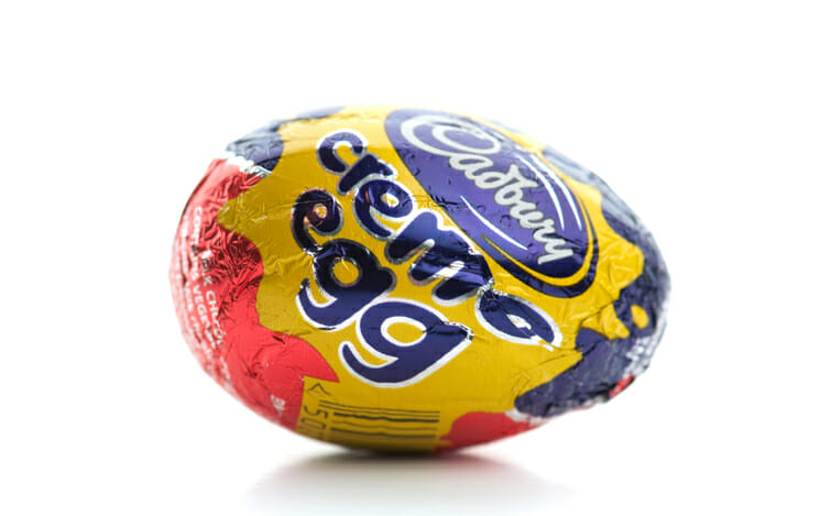 Cadbury Creme Egg sideways on white background