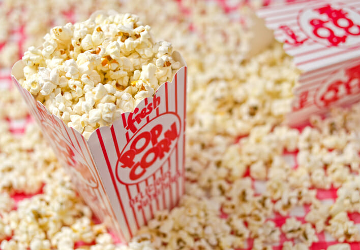 A box of freshly popped popcorn.