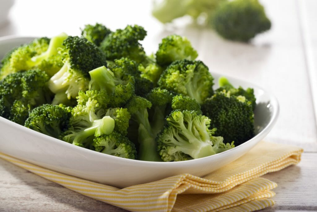 prepared broccoli in a bowl on table