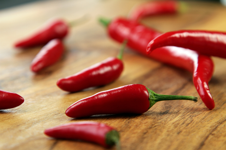 Red chilli peppers on the Cutting Board