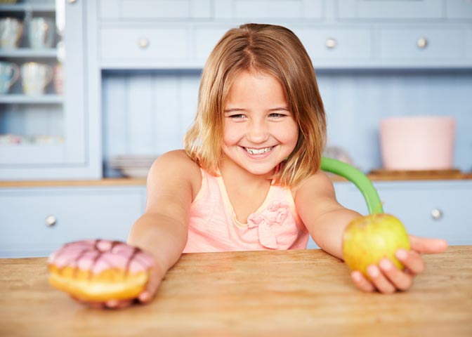 girl with apple and dougnut