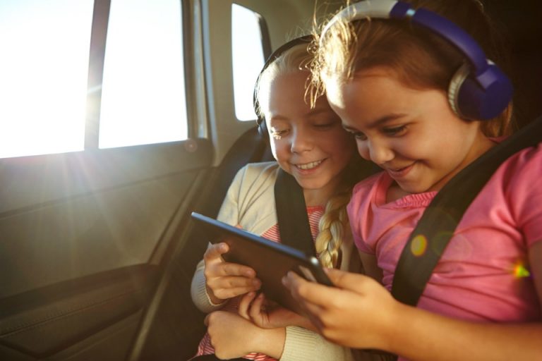 kids watching ipad in car