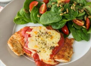 Chicken parmigiana with salad