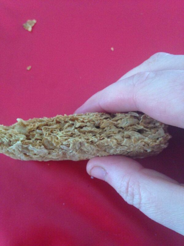 Slice Weetbix in half (holding firmly either side so it doesn't crumble) .