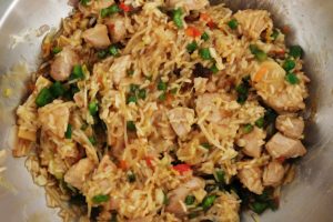 wok pan with rice, meat, paprika