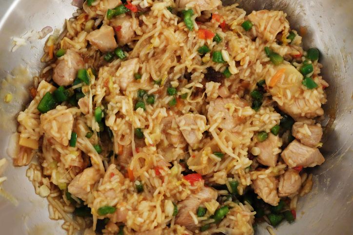 wok pan with rice, meat, paprika