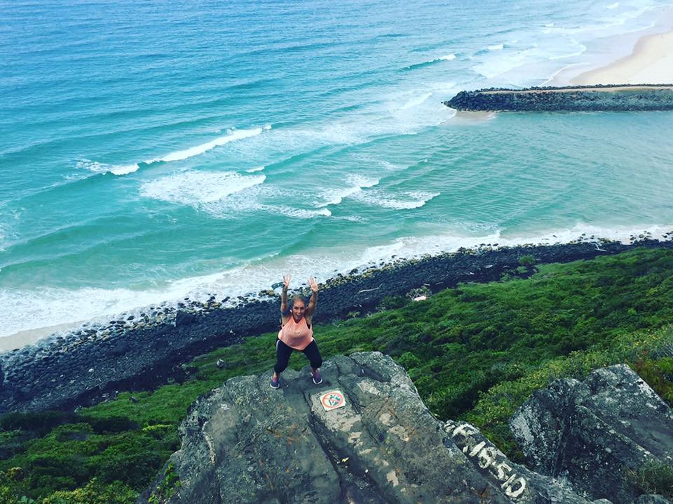 Lauren-da-Silva-squats-while-hiking