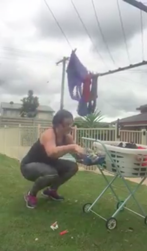 Nicola-Green-squat-while-hanging-washing-out