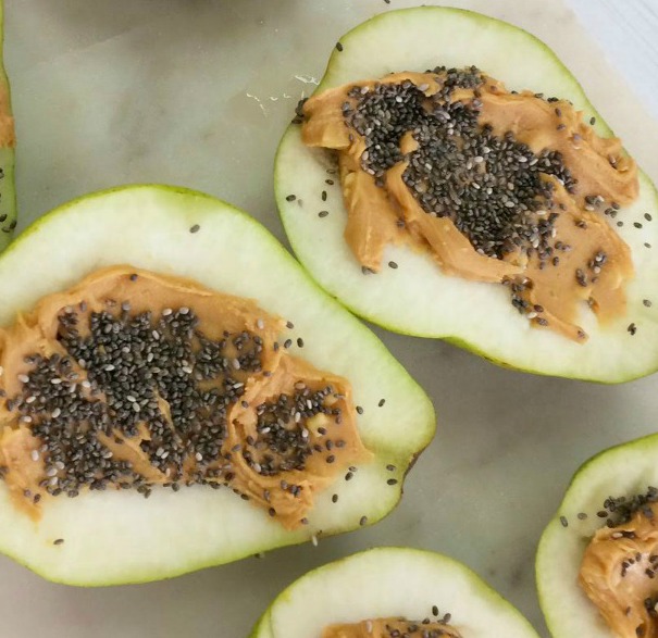 Delicious pears stuffed with peanut butter and chia