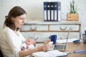 new mum working on laptop