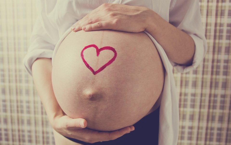pregnant belly with love heart