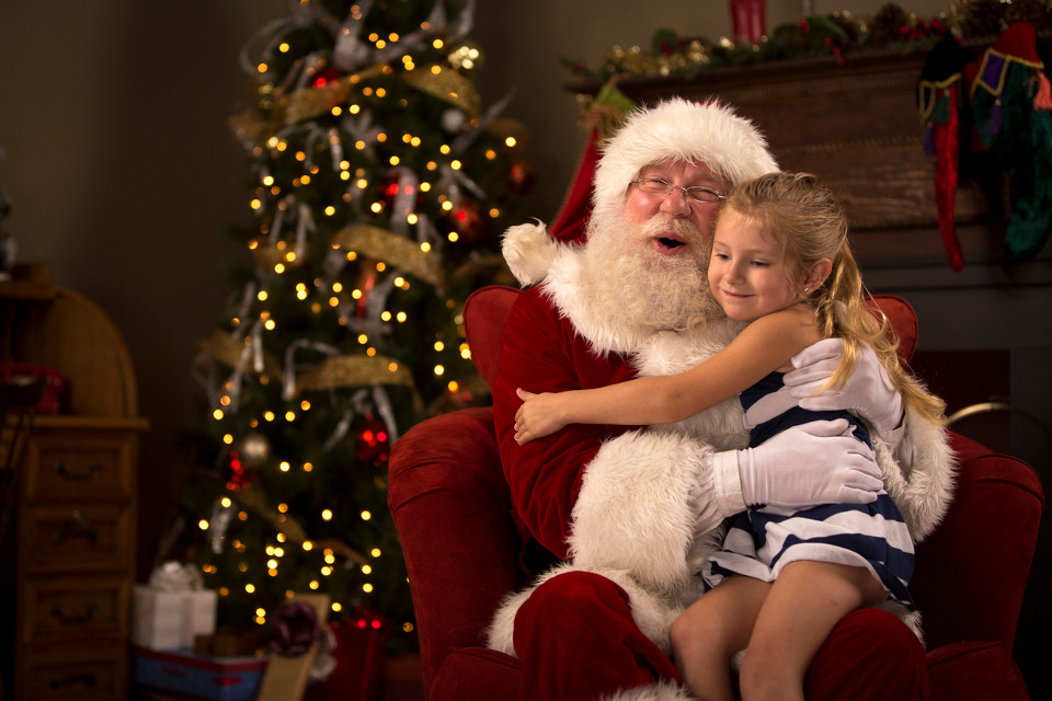 Santa Claus hugging child