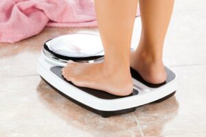 woman standing on scales