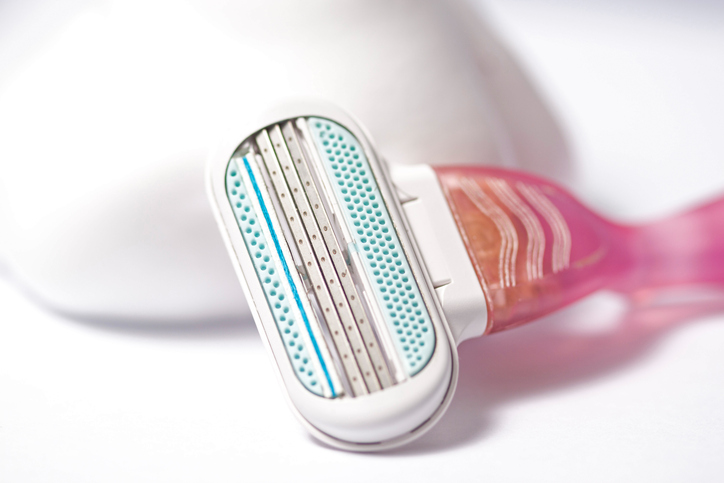 New female three-blade razor with pink handle