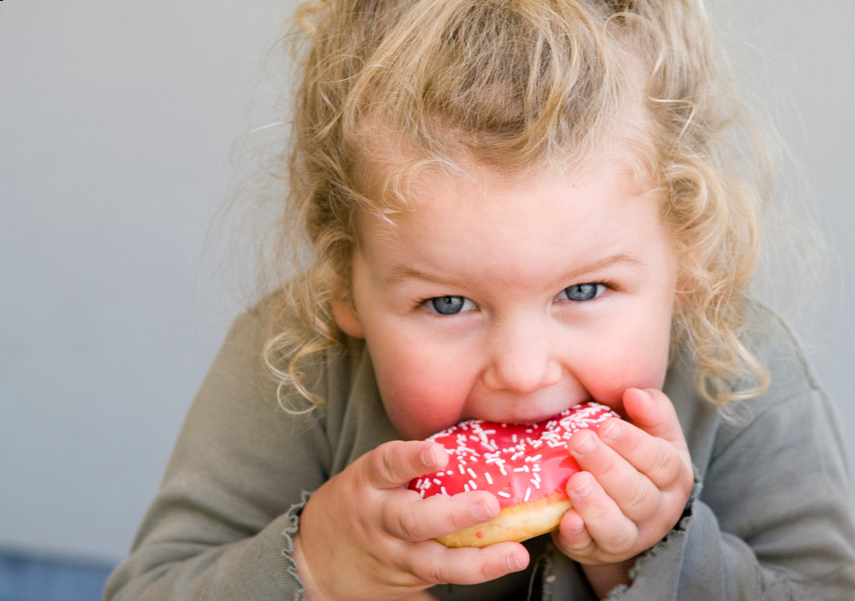 child eating junk food