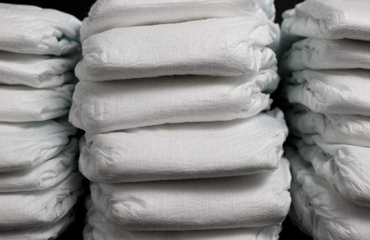 Neat piles of disposable diapers