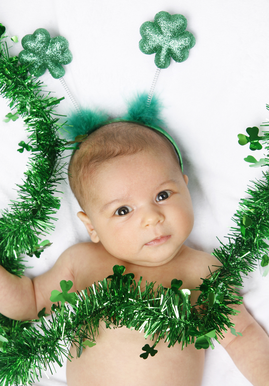 Baby dressed up for St. Patrick' s day.