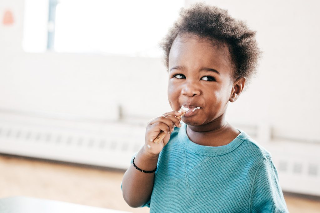 Girl eating yogurt