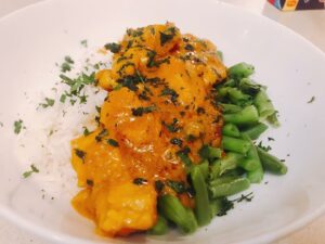 Easy-to-make butter chicken with rice and greens