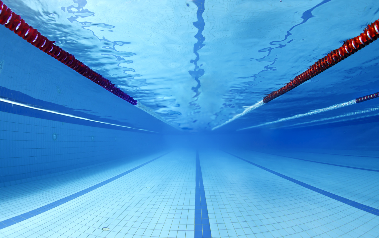 underwater view of empty indoor swimming pool