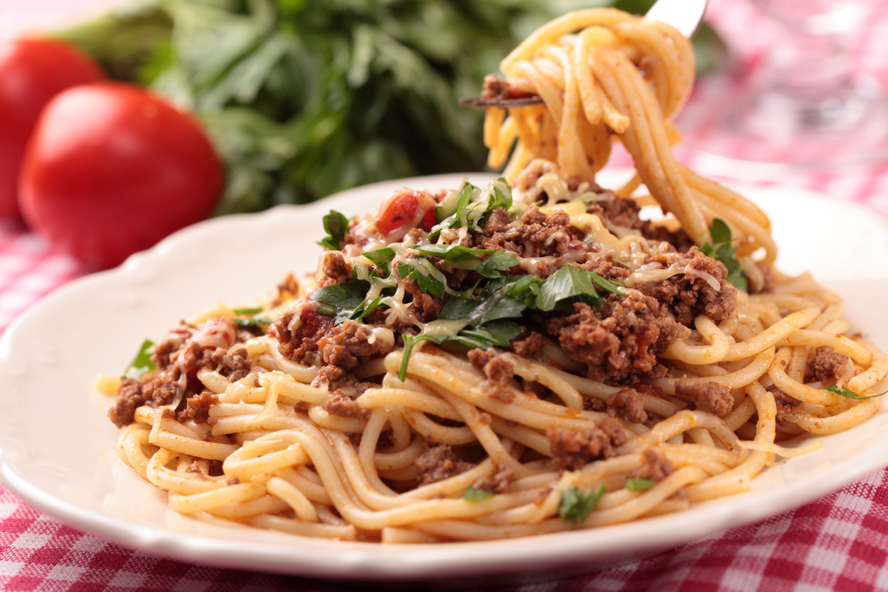 Spaghetti alla bolognese on a rustic table