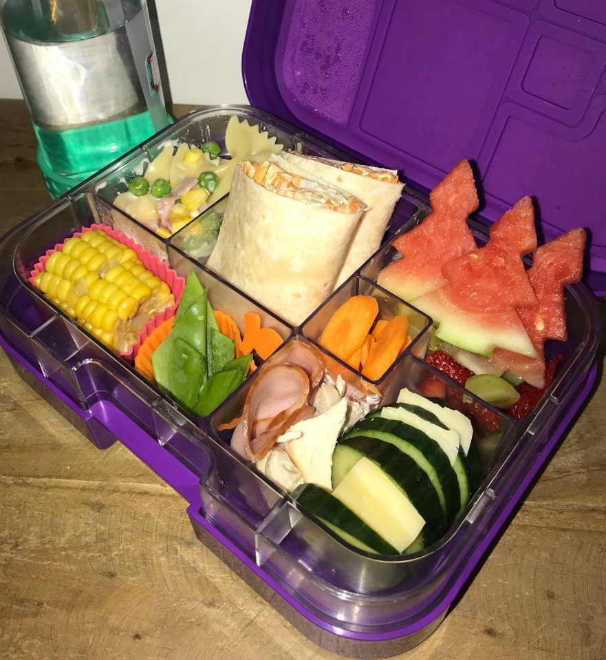 lunch box with fresh fruit and vegetables 