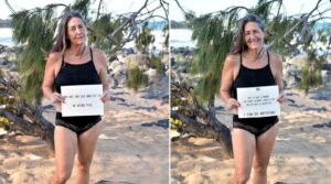 Woman standing on beach, proudly in black swimsuit after incredible weight loss success