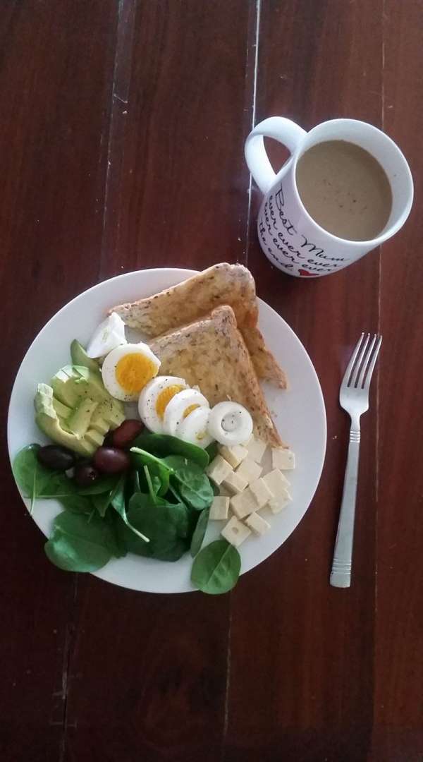 Hard boiled egg with toast and spinach