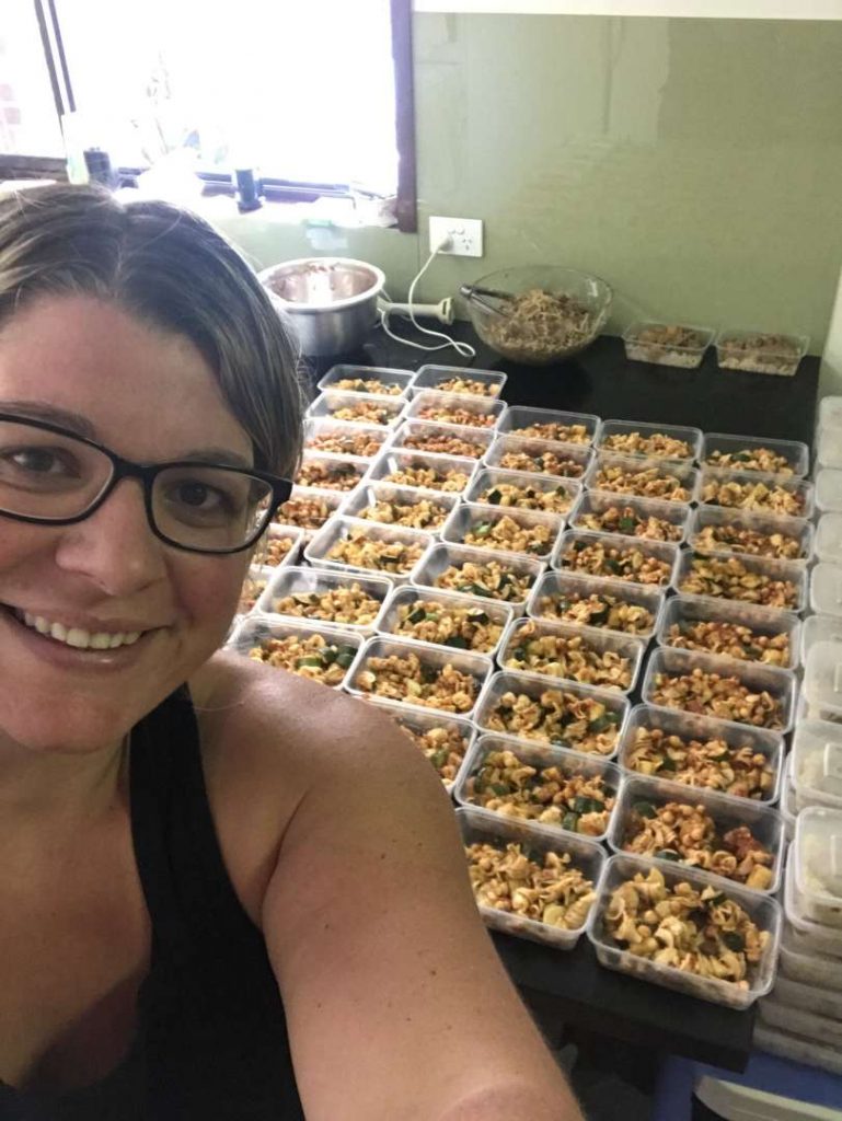 Chickpea, zucchini and tomato pasta laid out in containers 