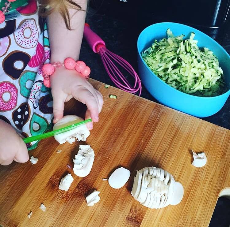 girl cutting mushrooms