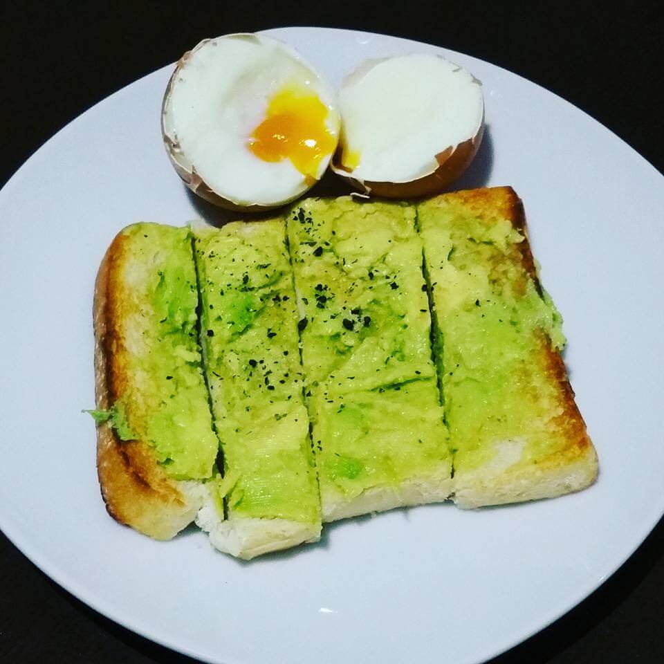 Runny boiled egg with avocado toast