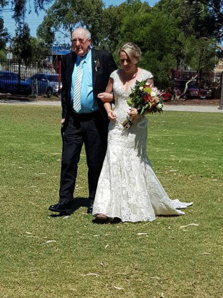 elyce and hugh walking down aisle