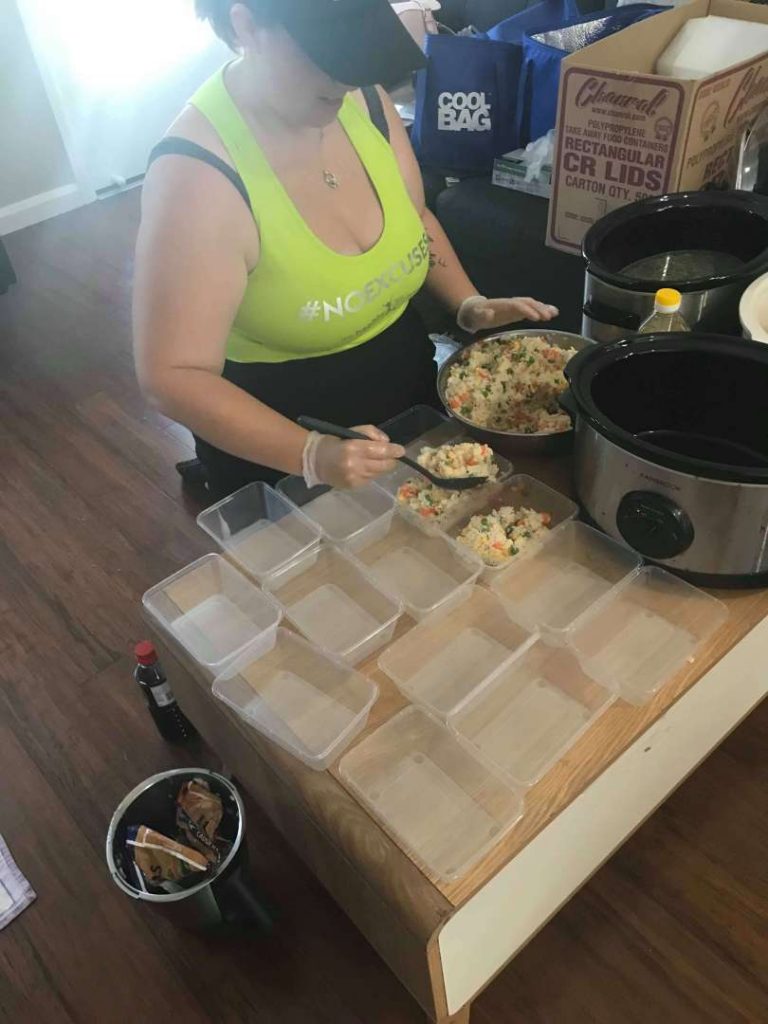 Mum spooning food into container