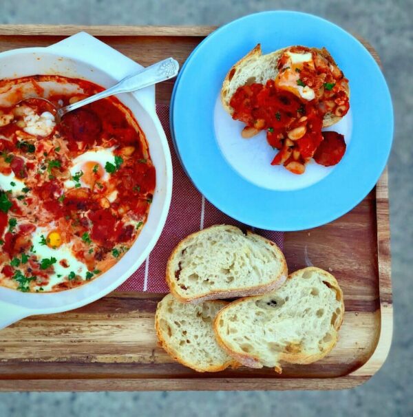 Baked eggs with chorizo and beans