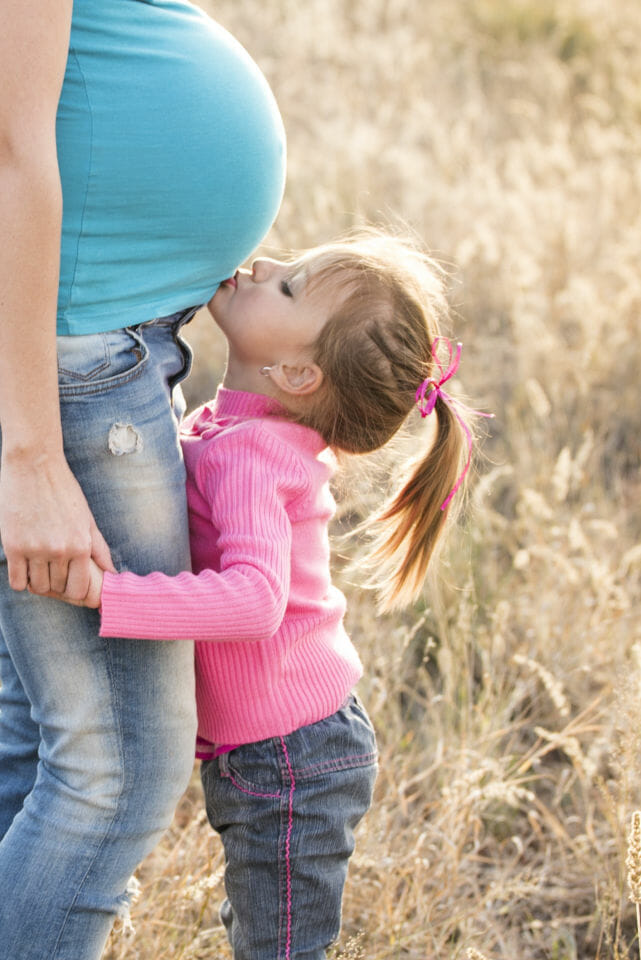 daughter kissing bump