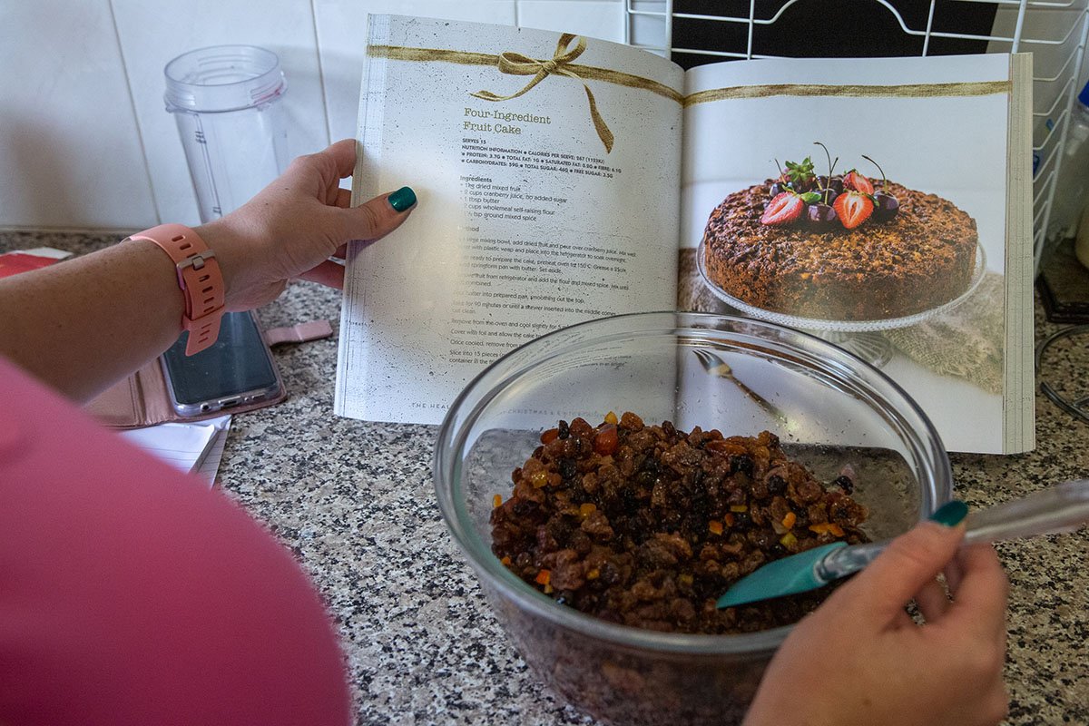 head chef healthy mummy checking cookbook