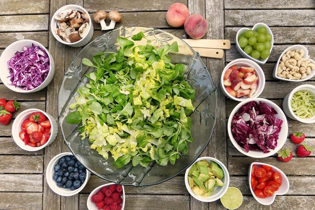 https://www.healthymummy.com/wp-content/uploads/2019/01/fruits-and-veggies-around-a-bowl-of-lettuce-mental-health-1024x684.jpg