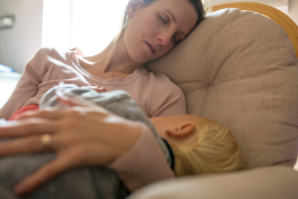 sleep deprived mum with child