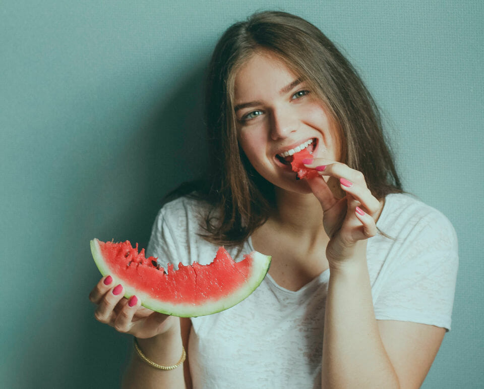 woman eating watermelon